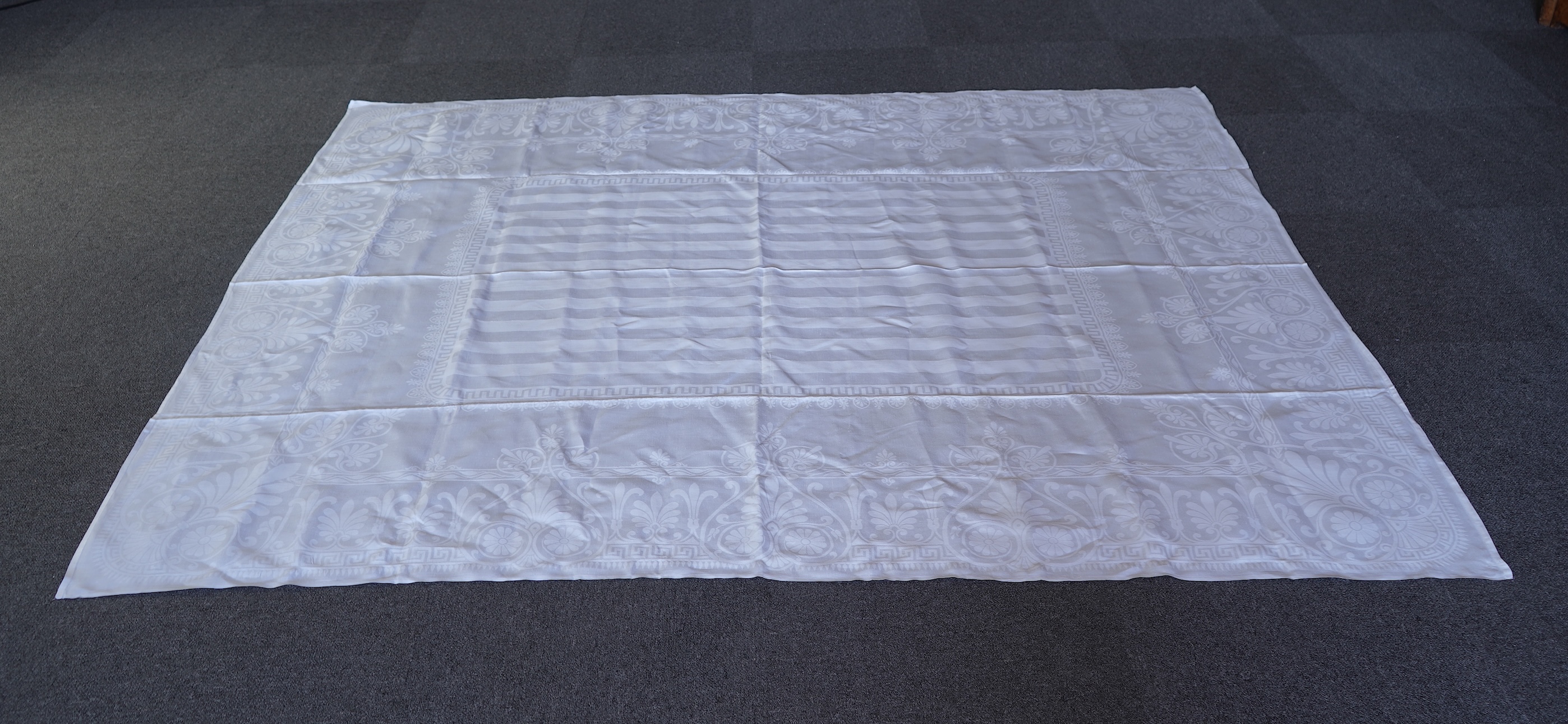 A late 19th century large white Irish damask table cloth, woven with an all over Christopher Dresser ‘inspired’ design. The overall design incorporating many of his known stylistic design motifs. Each corner has a shamro